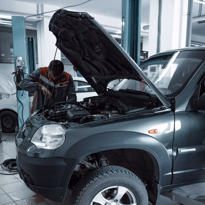 Mechanic working on Mercedes